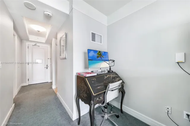 a spacious bedroom with a bed and window