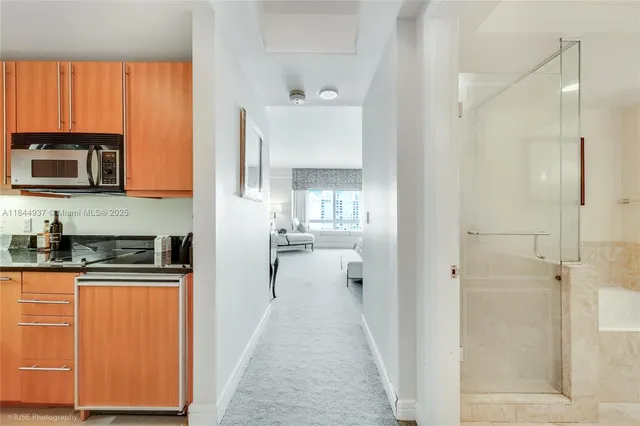 a view of a kitchen from the hallway