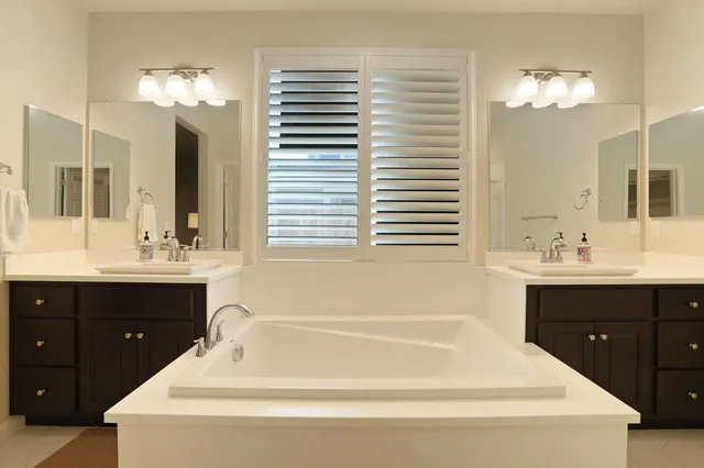 a work room with furniture and a window