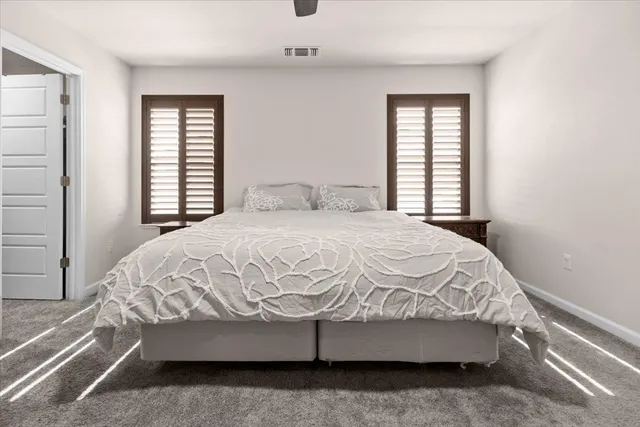 a view of a storage and utility room with washer and dryer