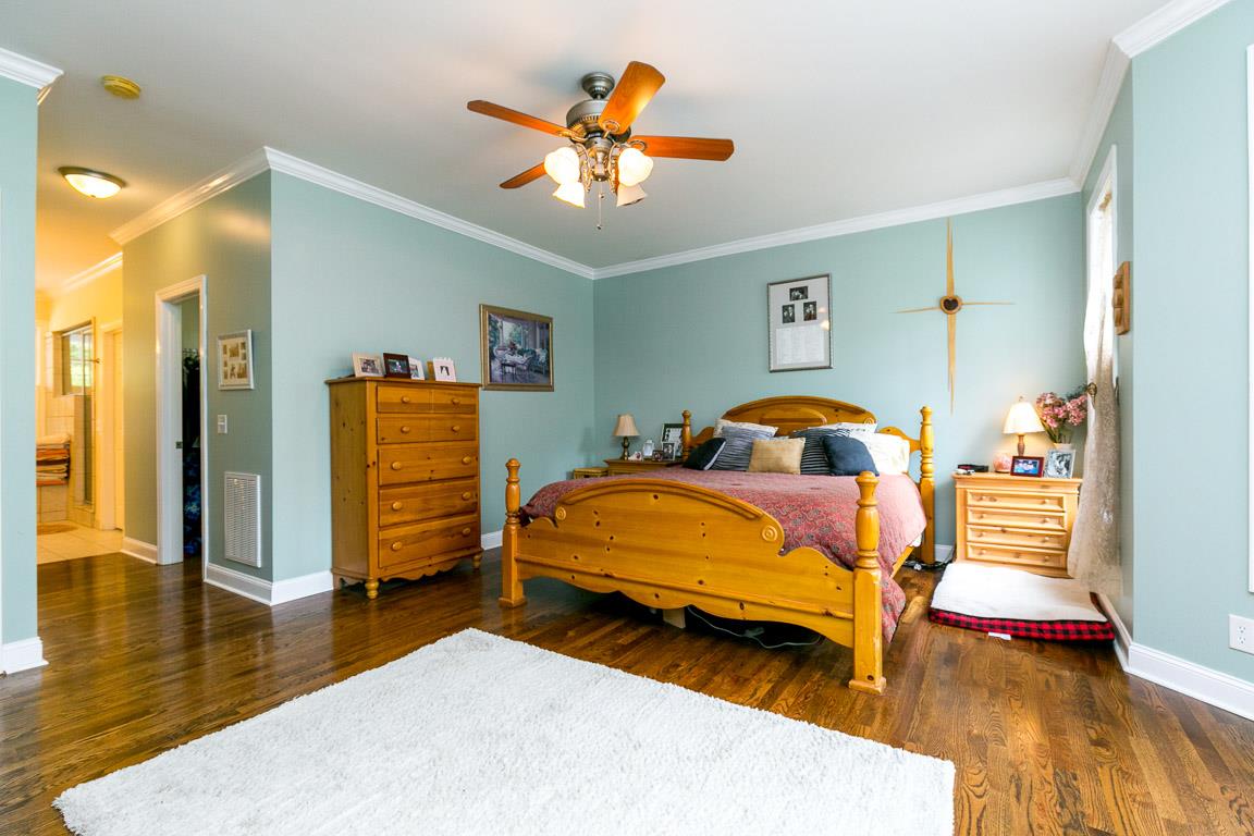 1160 Waller Road Brentwood, TN 37027 - Photo 12 of 28 a bedroom with a bed and wooden floor