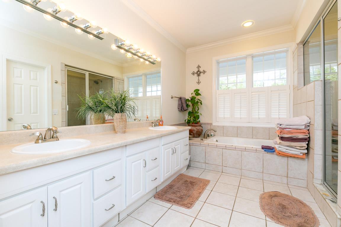 1160 Waller Road Brentwood, TN 37027 - Photo 13 of 28 a spacious bathroom with a double vanity sink a mirror and a bathtub