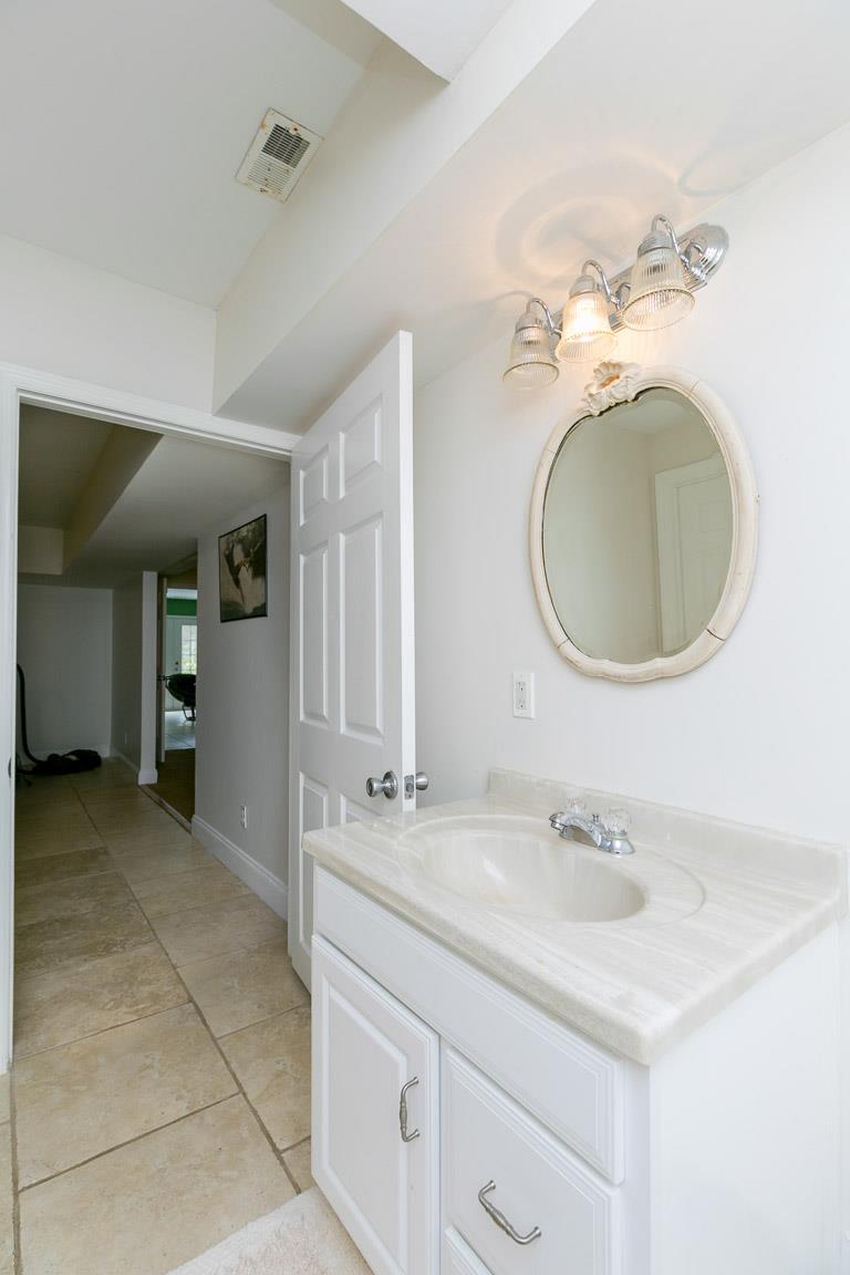 1160 Waller Road Brentwood, TN 37027 - Photo 22 of 28 a bathroom with a sink and a mirror