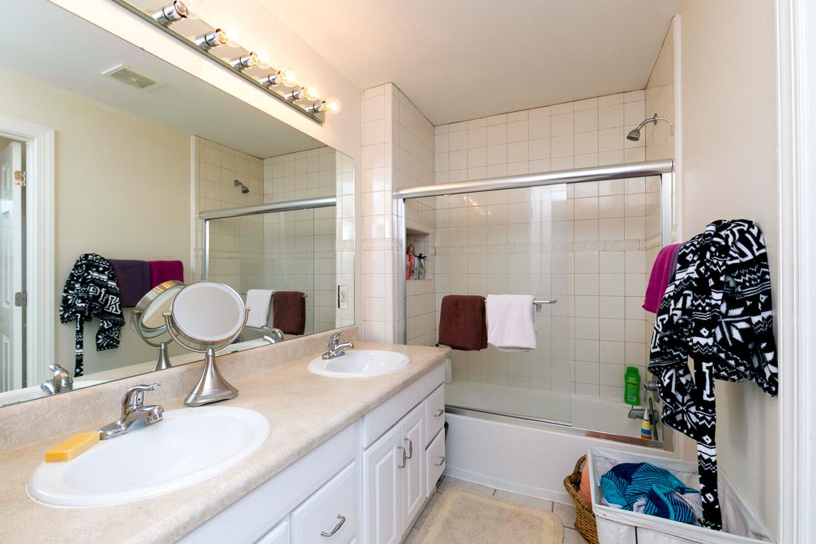 1160 Waller Road Brentwood, TN 37027 - Photo 24 of 28 a bathroom with a sink and a mirror