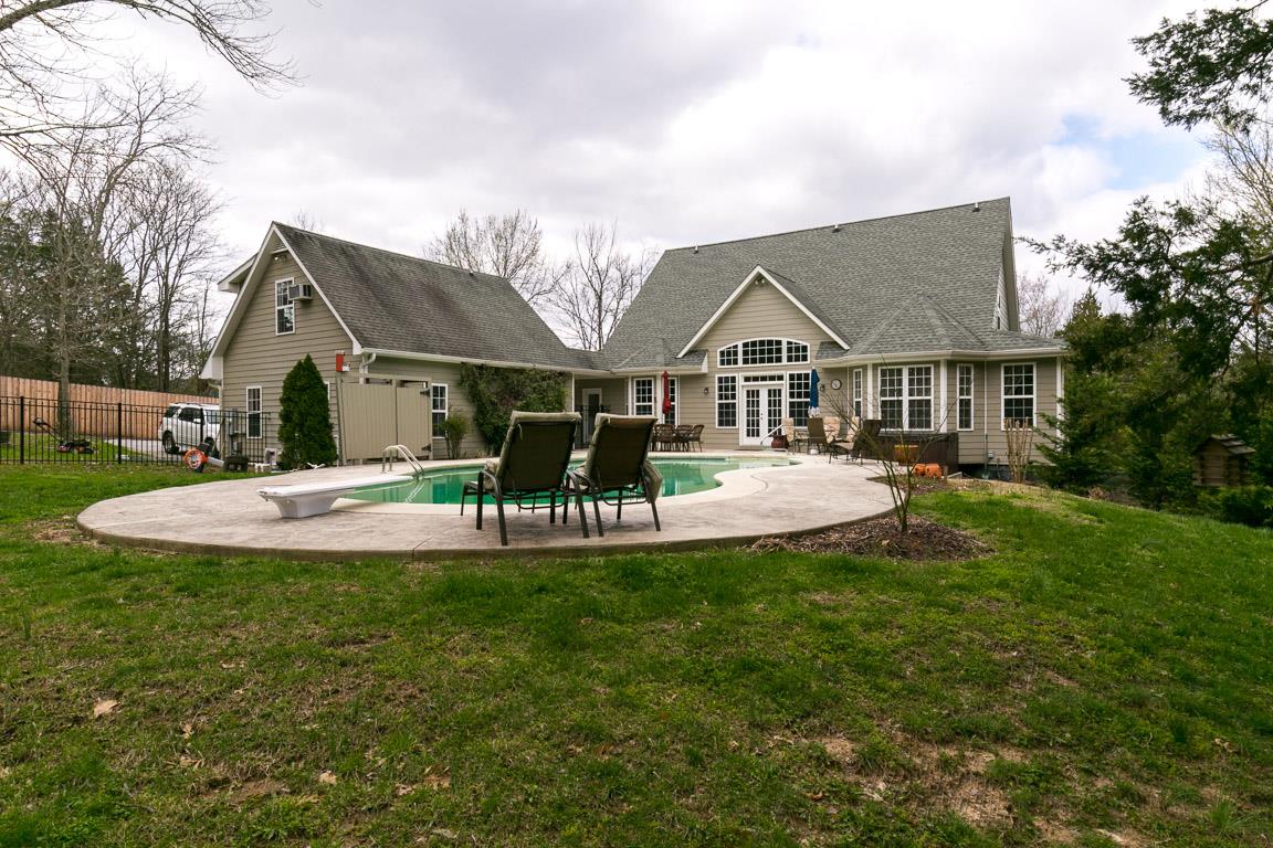 1160 Waller Road Brentwood, TN 37027 - Photo 27 of 28 a view of house with a big yard potted plants and large tree