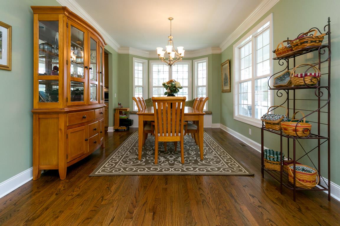 1160 Waller Road Brentwood, TN 37027 - Photo 8 of 28 a view of a dining room with furniture window and wooden floor