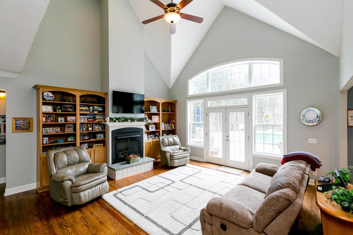1160 Waller Road Brentwood, TN 37027 - Photo 9 of 28 a living room with furniture a fireplace and a large window