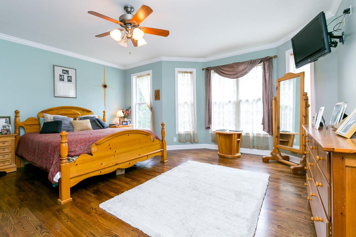 1160 Waller Road Brentwood, TN 37027 - Photo 10 of 28 a bedroom with a bed and wooden floor