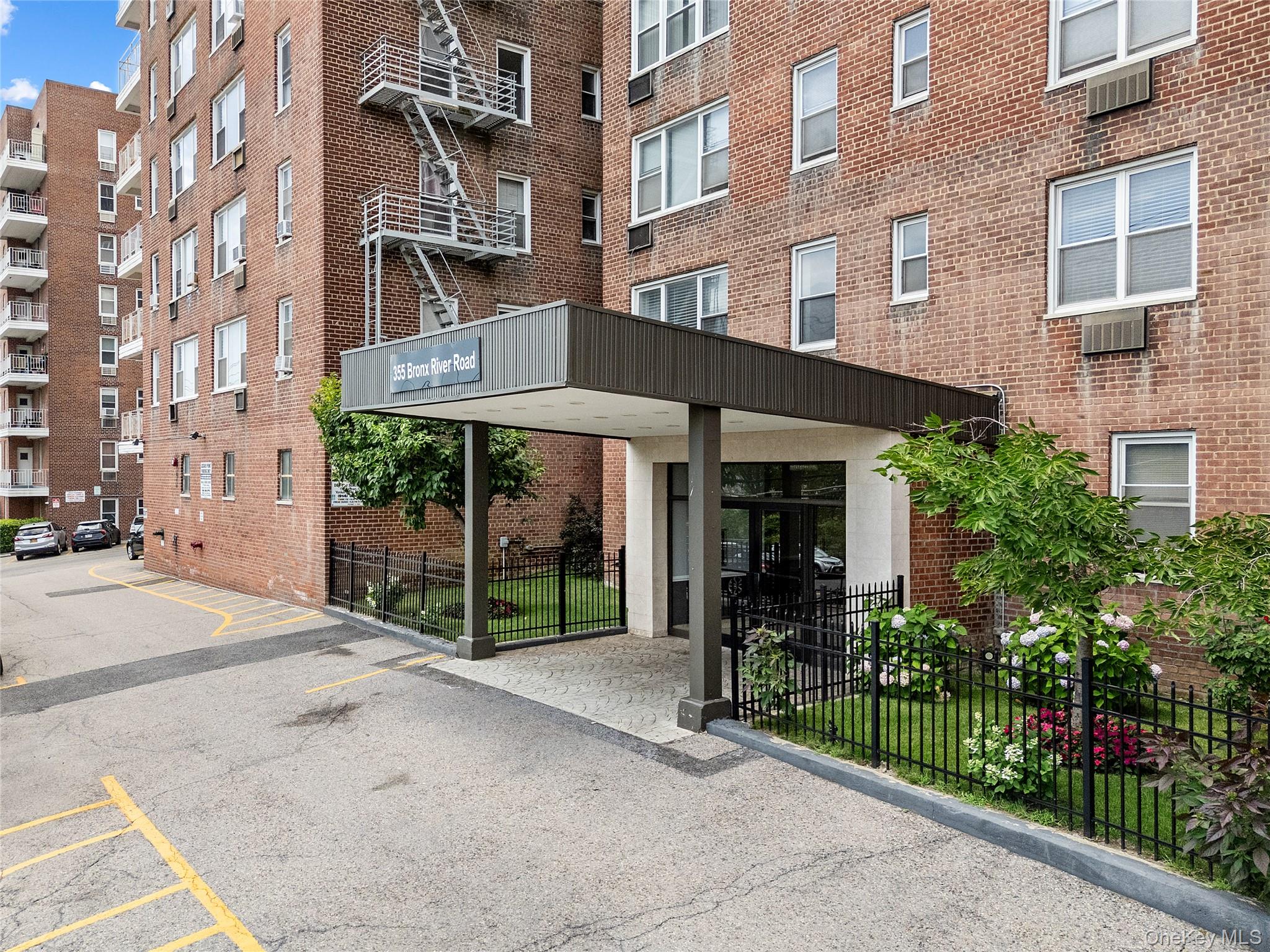 355 Bronx River Road, Unit 1I Yonkers, NY 10704 - Photo 1 of 22 View of apartment building / complex with uncovered parking