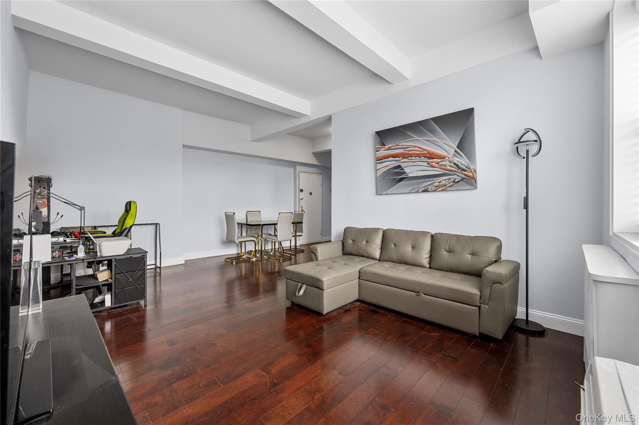 355 Bronx River Road, Unit 1I Yonkers, NY 10704 - Photo 3 of 22 Living room with hardwood / wood-style flooring and beamed ceiling