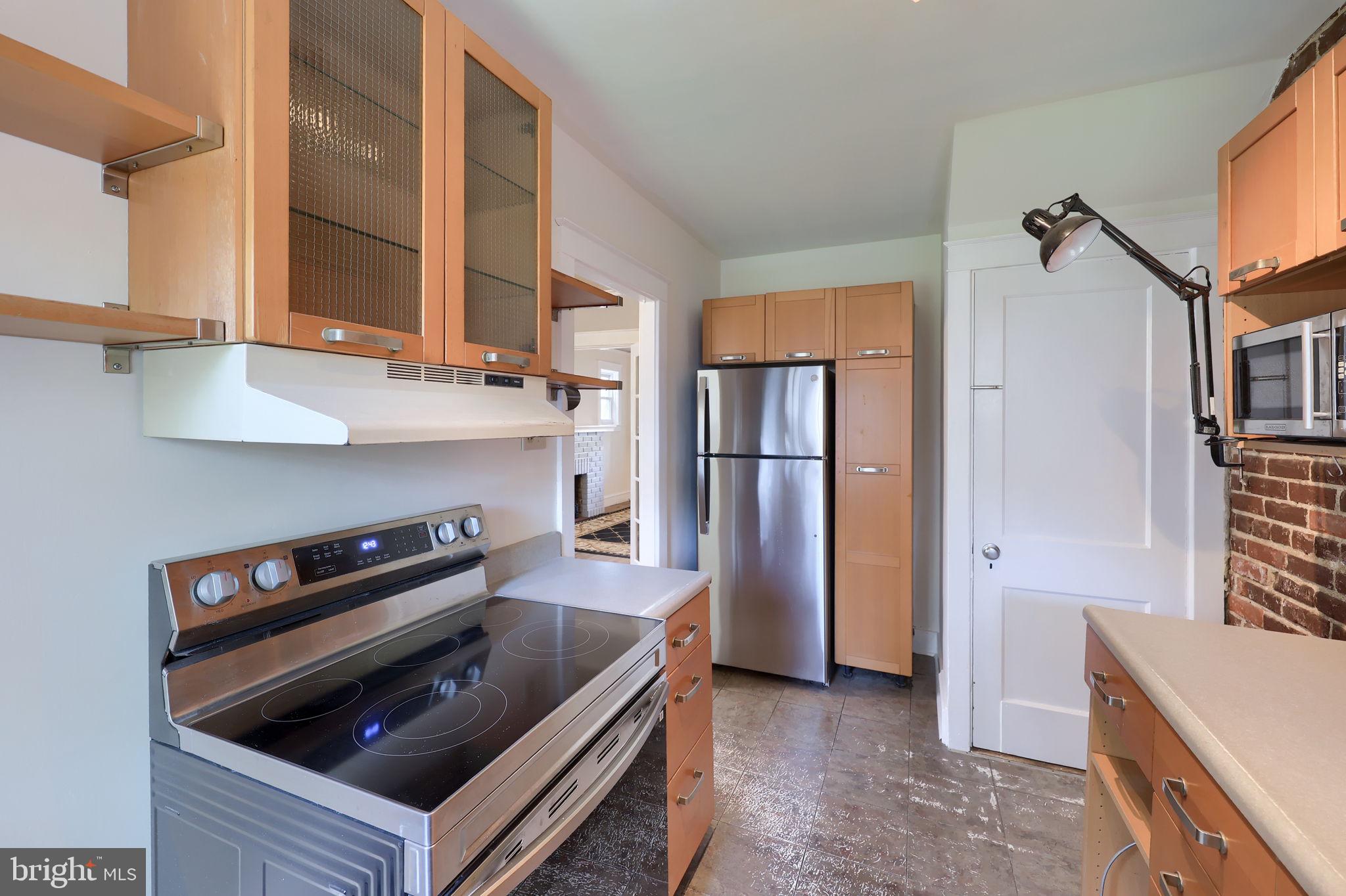 836 3rd Street Lancaster, PA 17603 - Photo 15 of 30 a kitchen with a stove and a refrigerator