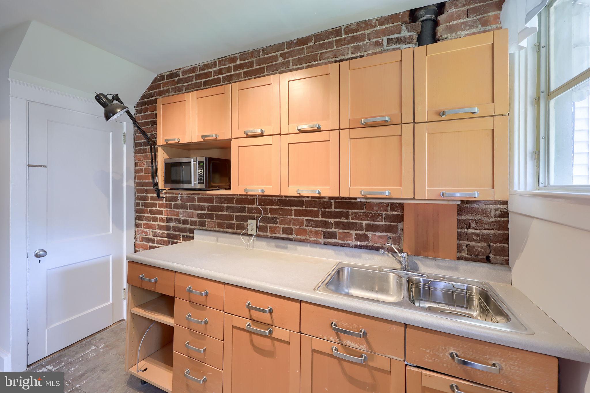 836 3rd Street Lancaster, PA 17603 - Photo 16 of 30 a kitchen with a sink and a window