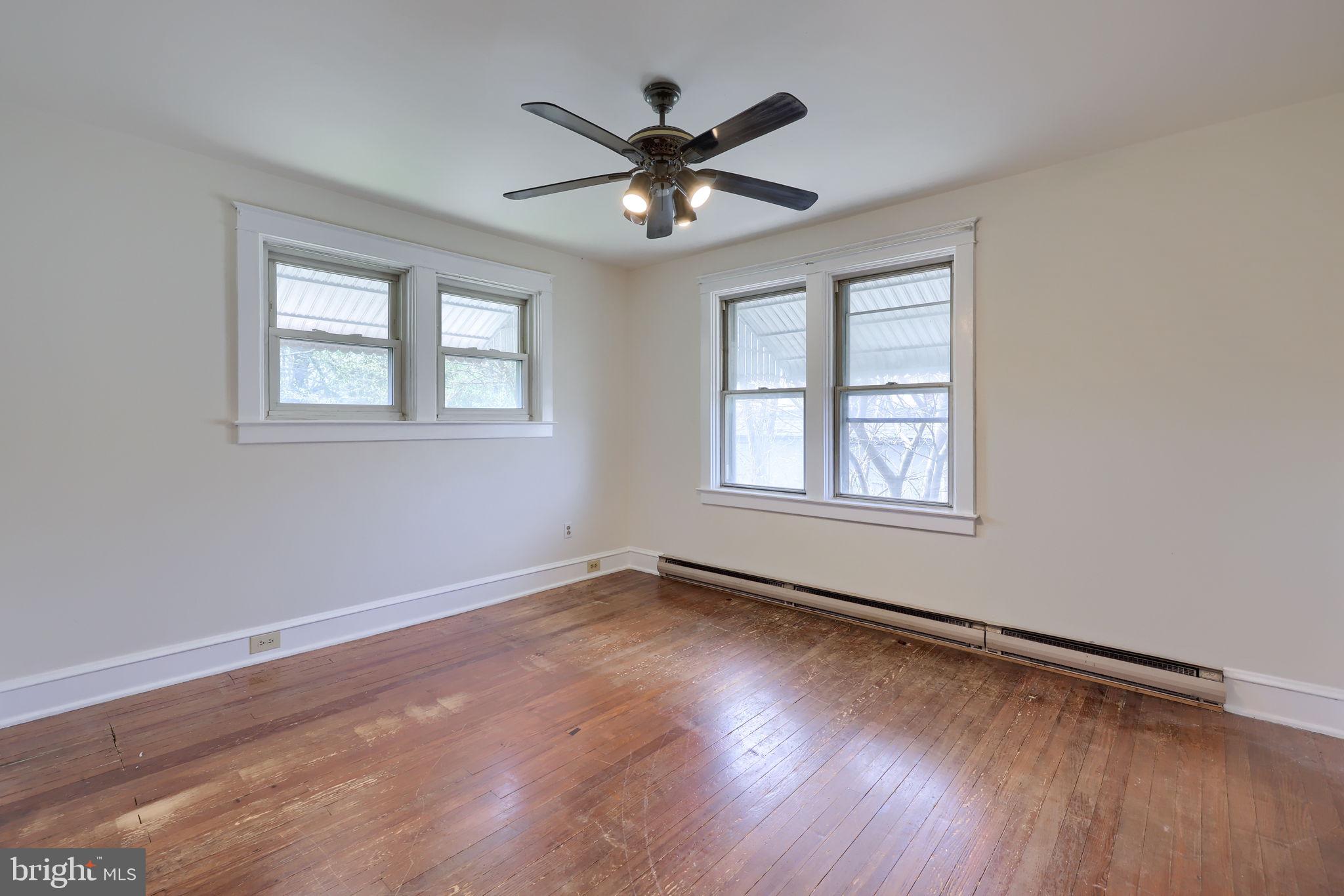 836 3rd Street Lancaster, PA 17603 - Photo 18 of 30 a view of an empty room with wooden floor and a window