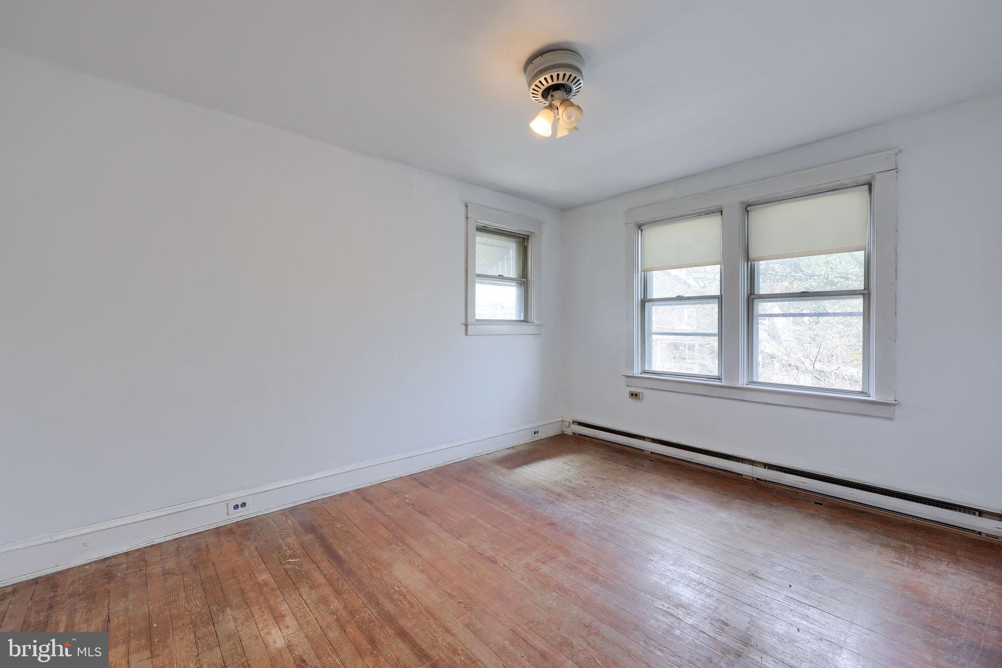 836 3rd Street Lancaster, PA 17603 - Photo 19 of 30 an empty room with windows and chandelier fan