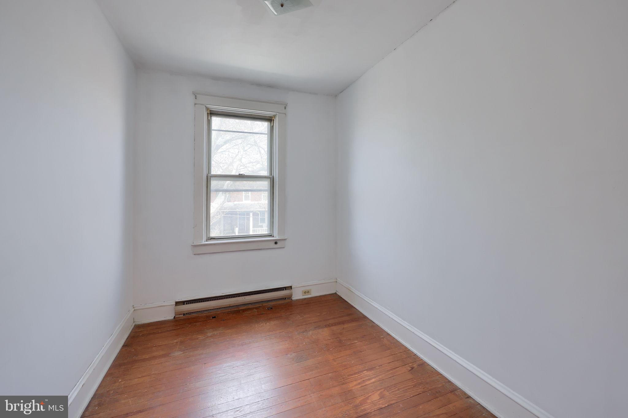 836 3rd Street Lancaster, PA 17603 - Photo 21 of 30 a view of an empty room with wooden floor and a window