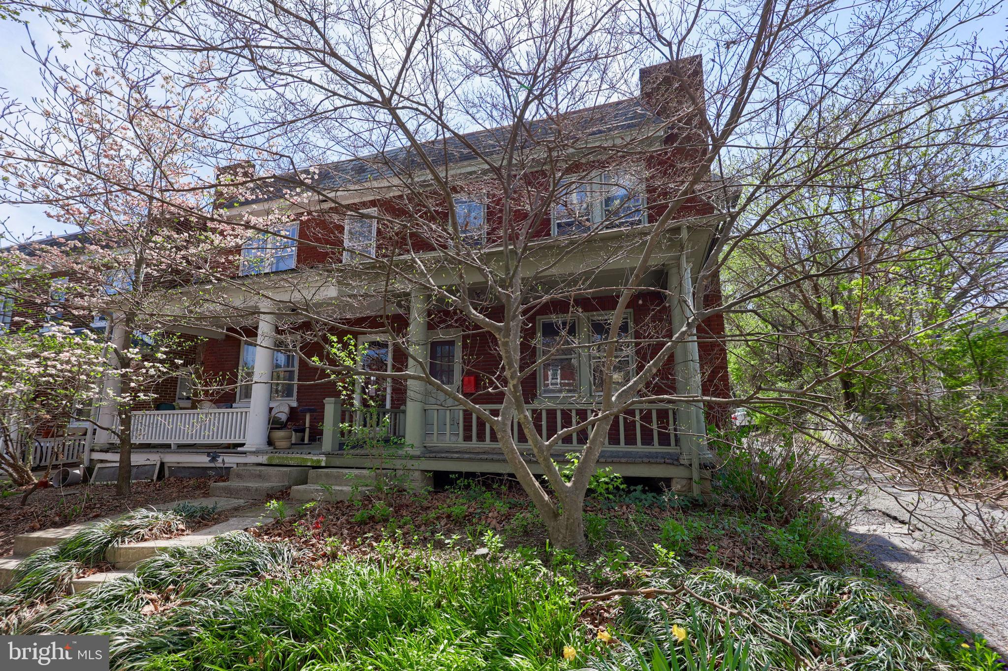 836 3rd Street Lancaster, PA 17603 - Photo 29 of 30 a view of a tall house with large trees and plants