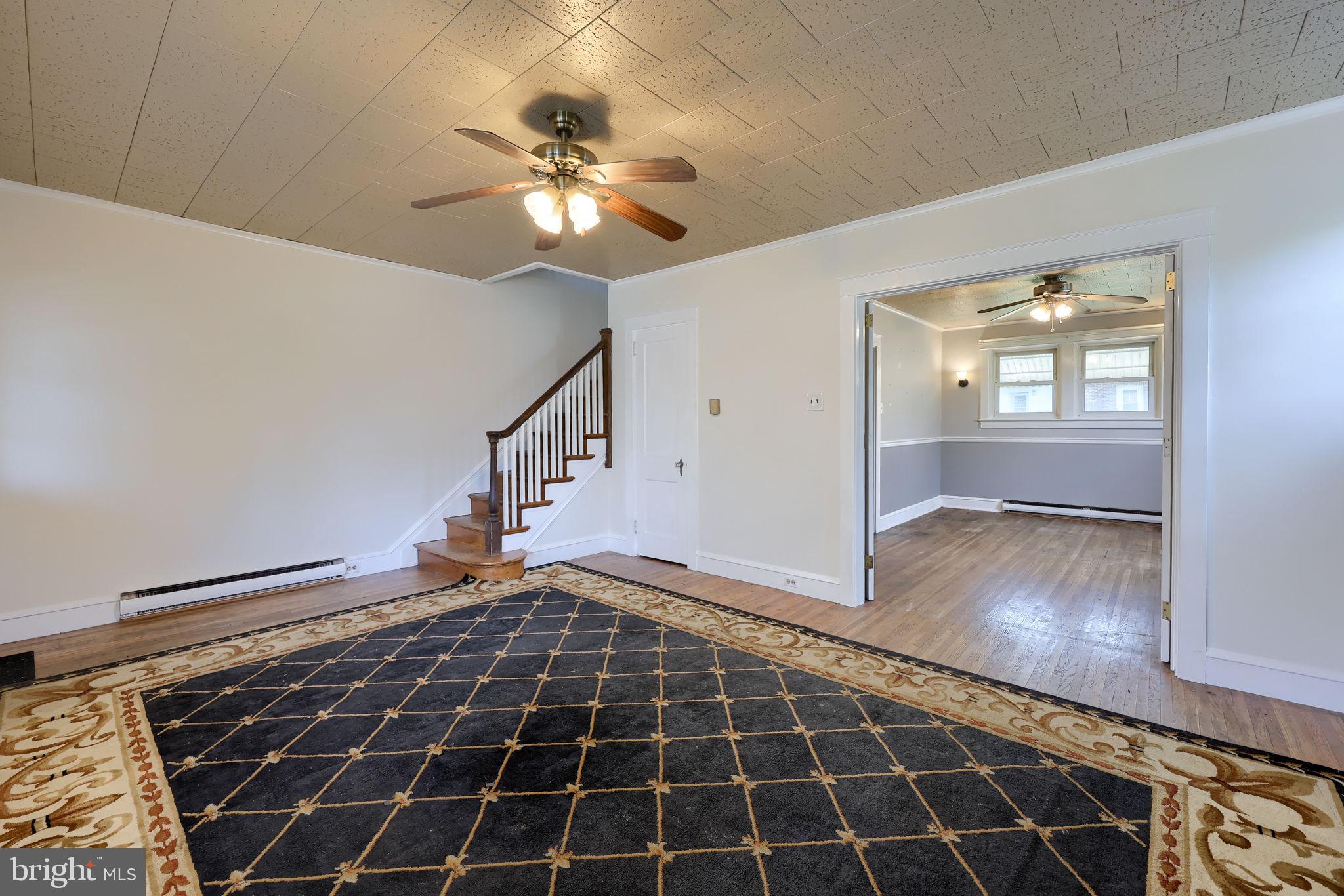 836 3rd Street Lancaster, PA 17603 - Photo 6 of 30 a view of an empty room with wooden floor and fan
