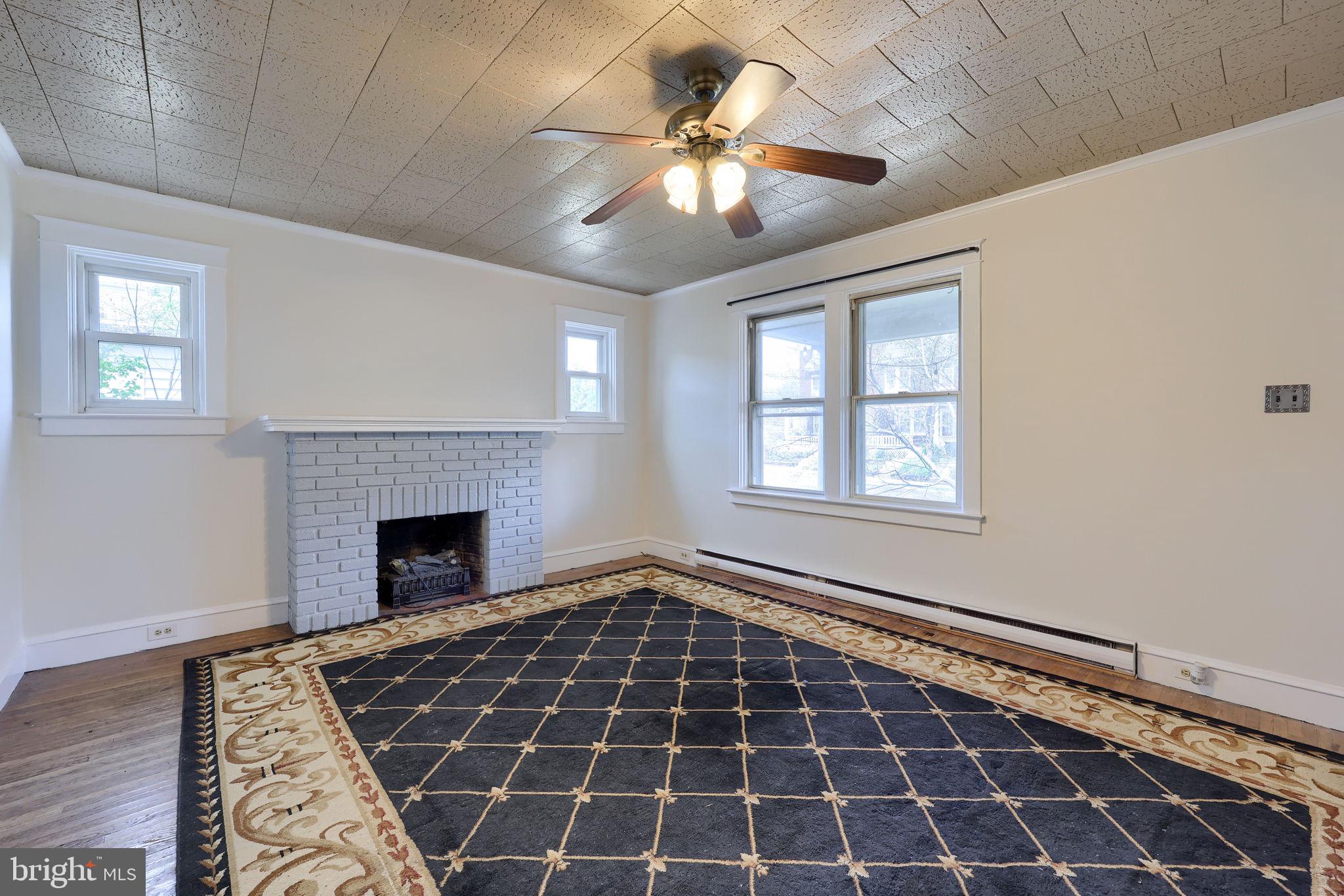 836 3rd Street Lancaster, PA 17603 - Photo 8 of 30 a view of an empty room with window and chandelier fan