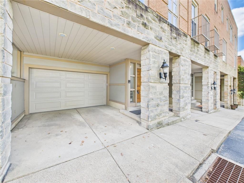 138 North Woodland Road Pittsburgh, PA 15232 - Photo 1 of 50 a view of a brick house with parking space