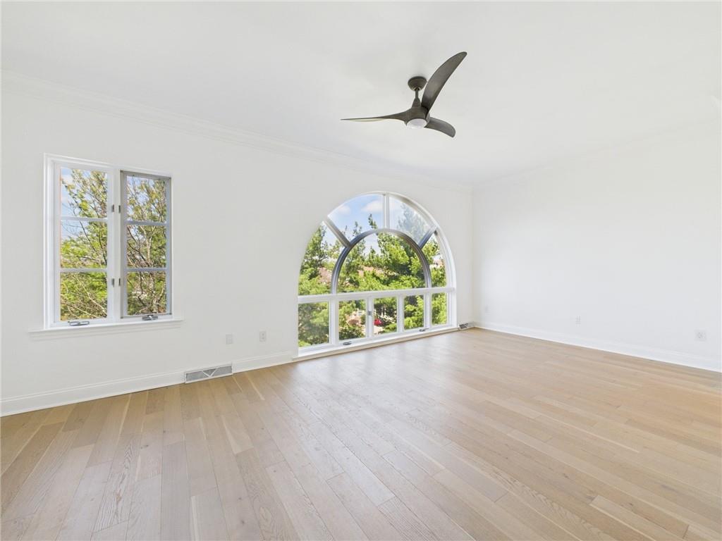 138 North Woodland Road Pittsburgh, PA 15232 - Photo 14 of 50 an empty room with wooden floor fan and windows