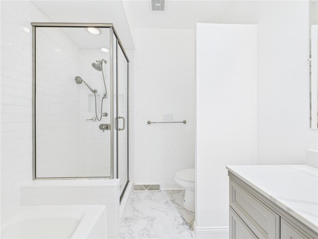 138 North Woodland Road Pittsburgh, PA 15232 - Photo 18 of 50 a bathroom with a granite countertop sink a toilet and shower