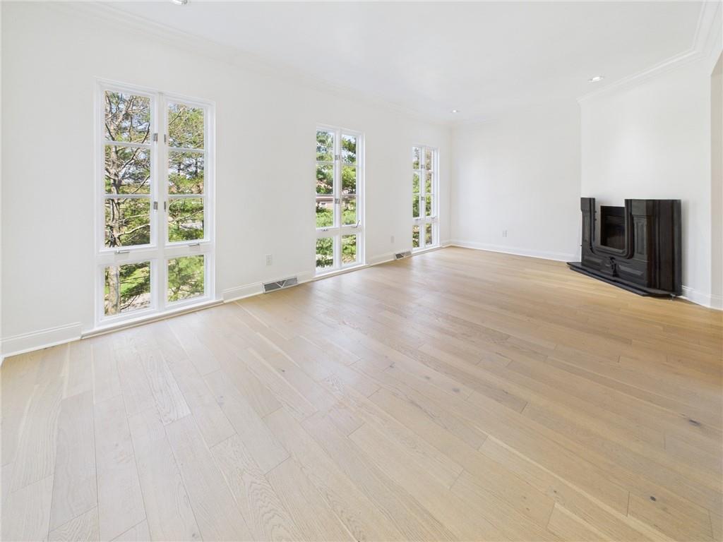 138 North Woodland Road Pittsburgh, PA 15232 - Photo 20 of 50 a view of an empty room with a window and wooden floor
