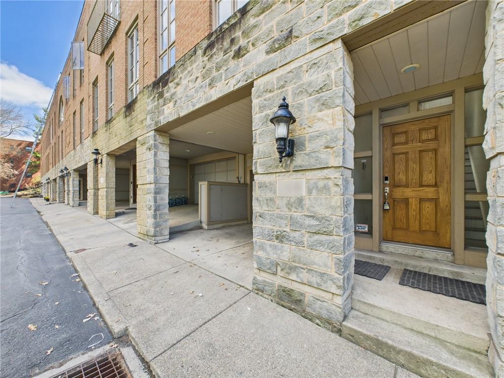 138 North Woodland Road Pittsburgh, PA 15232 - Photo 2 of 50 a view of a brick house with large windows