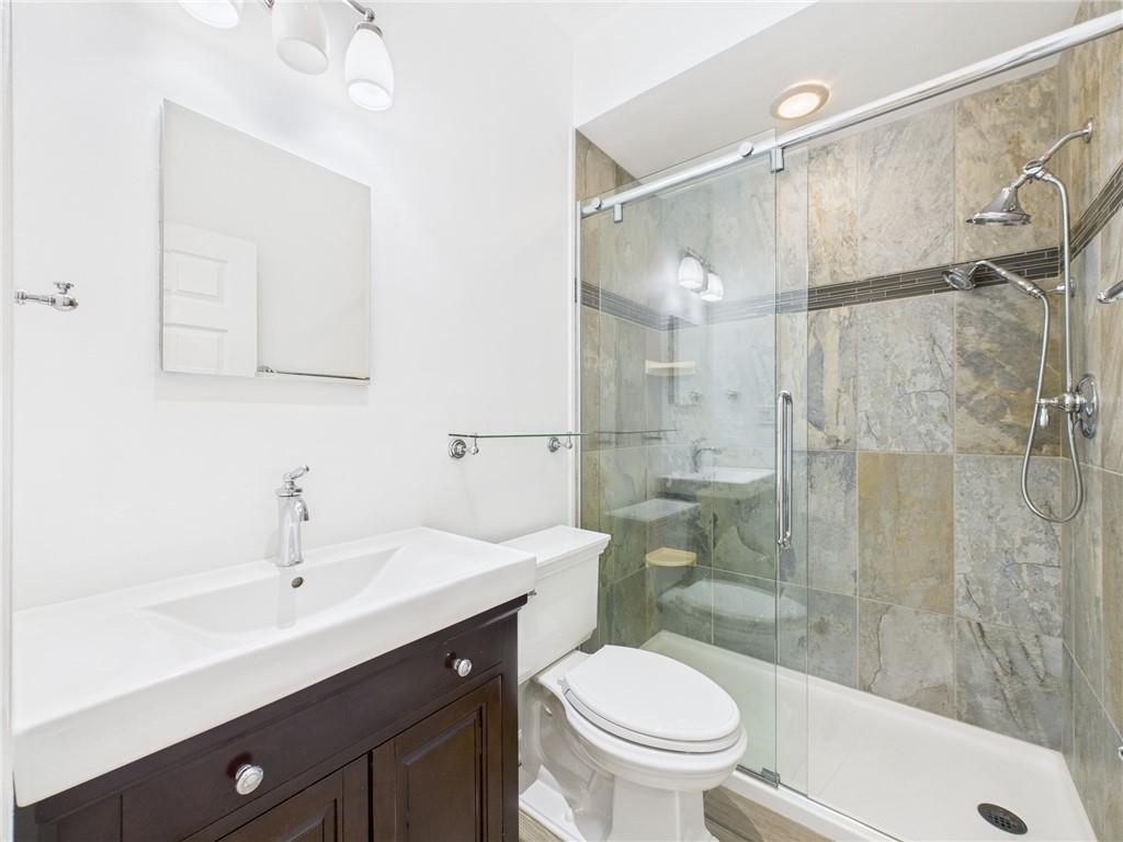 138 North Woodland Road Pittsburgh, PA 15232 - Photo 23 of 50 a bathroom with a sink shower and a toilet