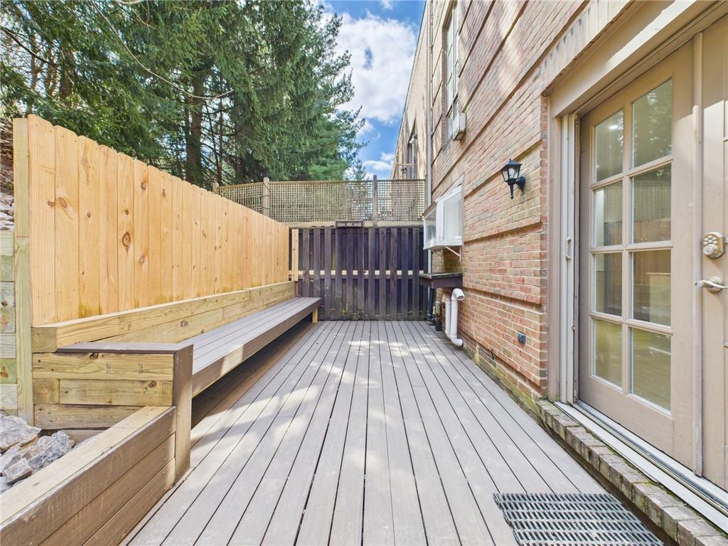 138 North Woodland Road Pittsburgh, PA 15232 - Photo 36 of 50 a view of balcony with wooden floor and fence and a floor to ceiling window