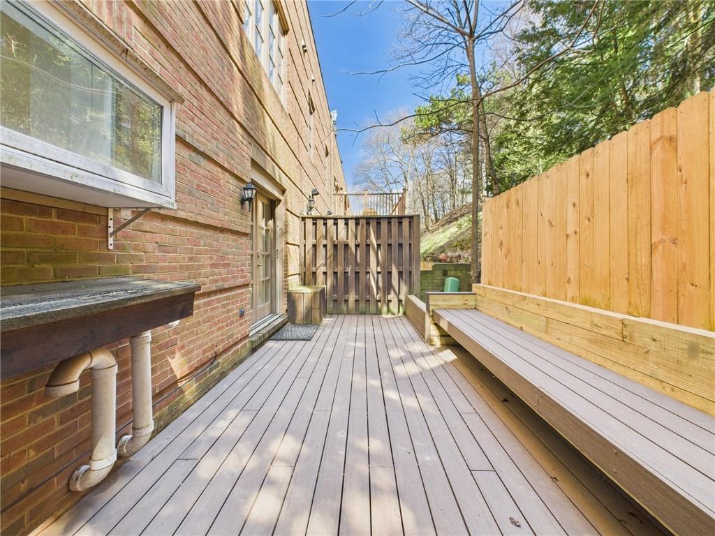138 North Woodland Road Pittsburgh, PA 15232 - Photo 37 of 50 a view of balcony with wooden floor and fence and floor to ceiling window