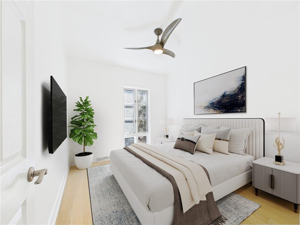 138 North Woodland Road Pittsburgh, PA 15232 - Photo 7 of 50 a bedroom with a bed and a flat screen tv