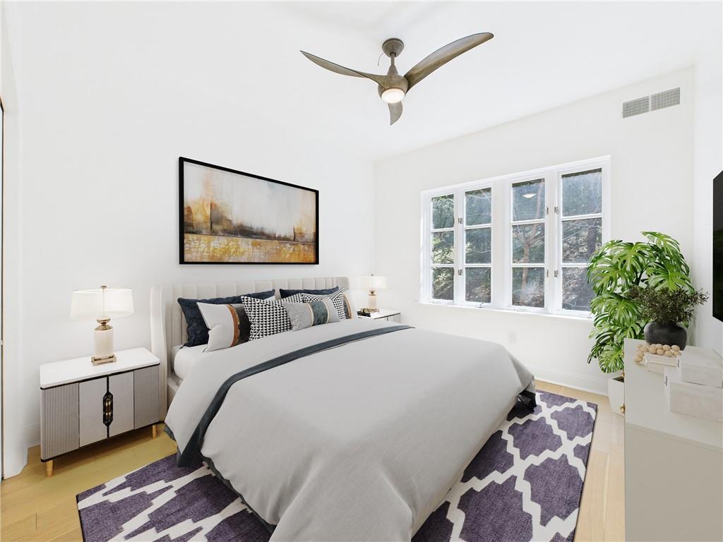 138 North Woodland Road Pittsburgh, PA 15232 - Photo 8 of 50 a spacious bedroom with a large bed and a window