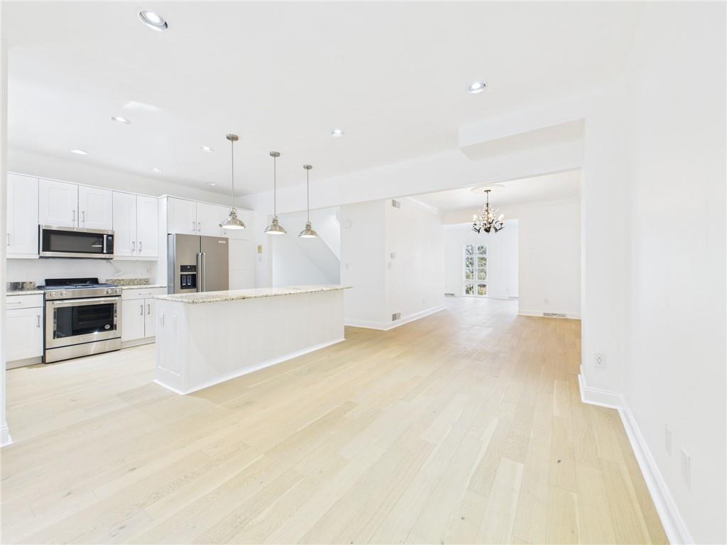 138 North Woodland Road Pittsburgh, PA 15232 - Photo 9 of 50 a view of a kitchen with microwave and cabinets