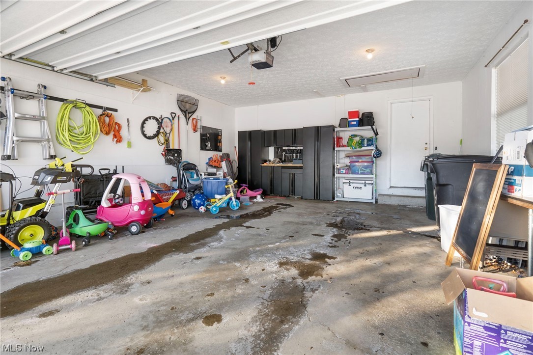 801 Netherwood Avenue Northwest Canton, OH 44708 - Photo 31 of 44 Garage featuring a garage door opener, tool cabinets are negotiable