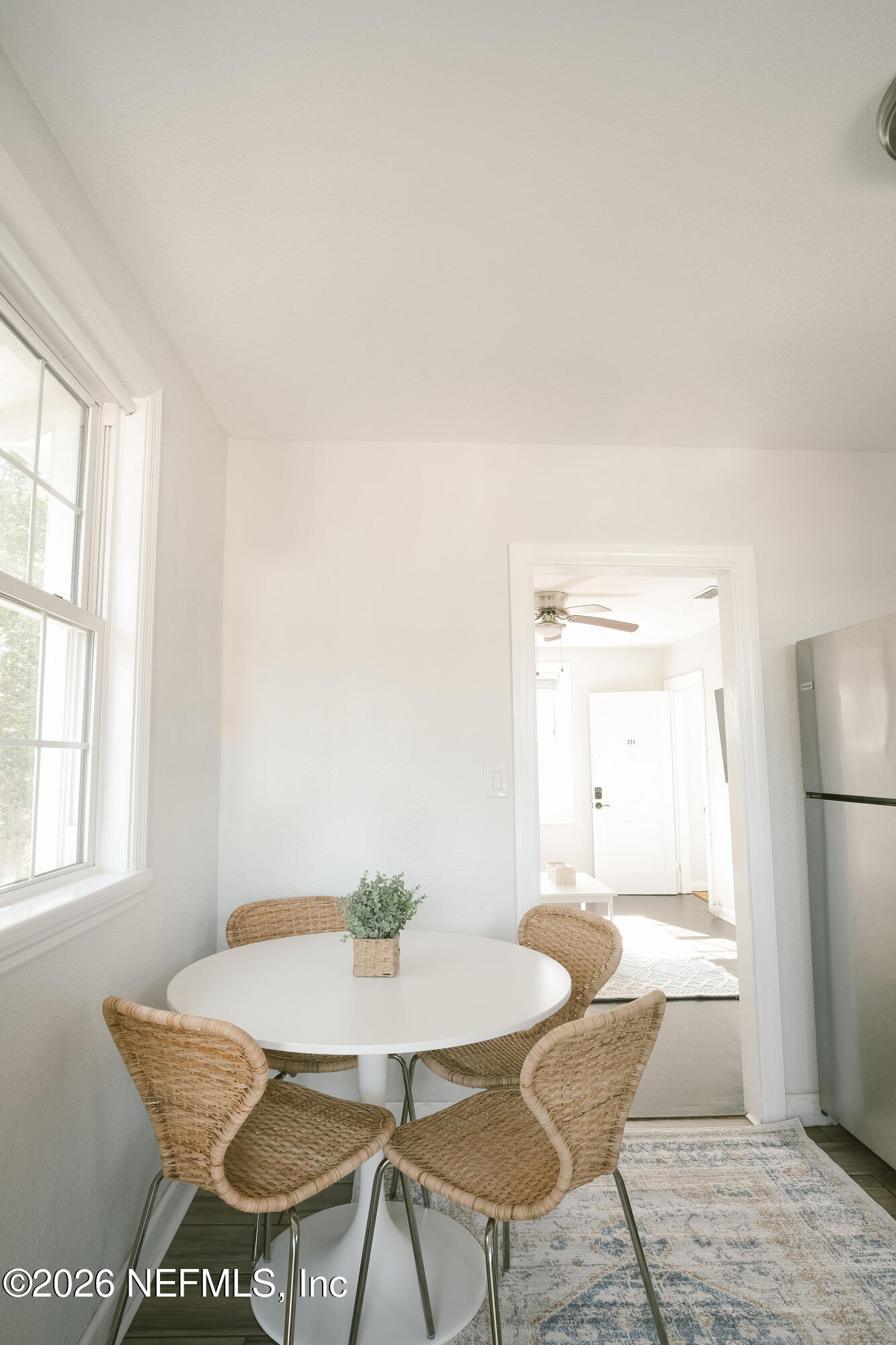 212 Oak Street Neptune Beach, FL 32266 - Photo 12 of 43 a view of a dining room with furniture and a window