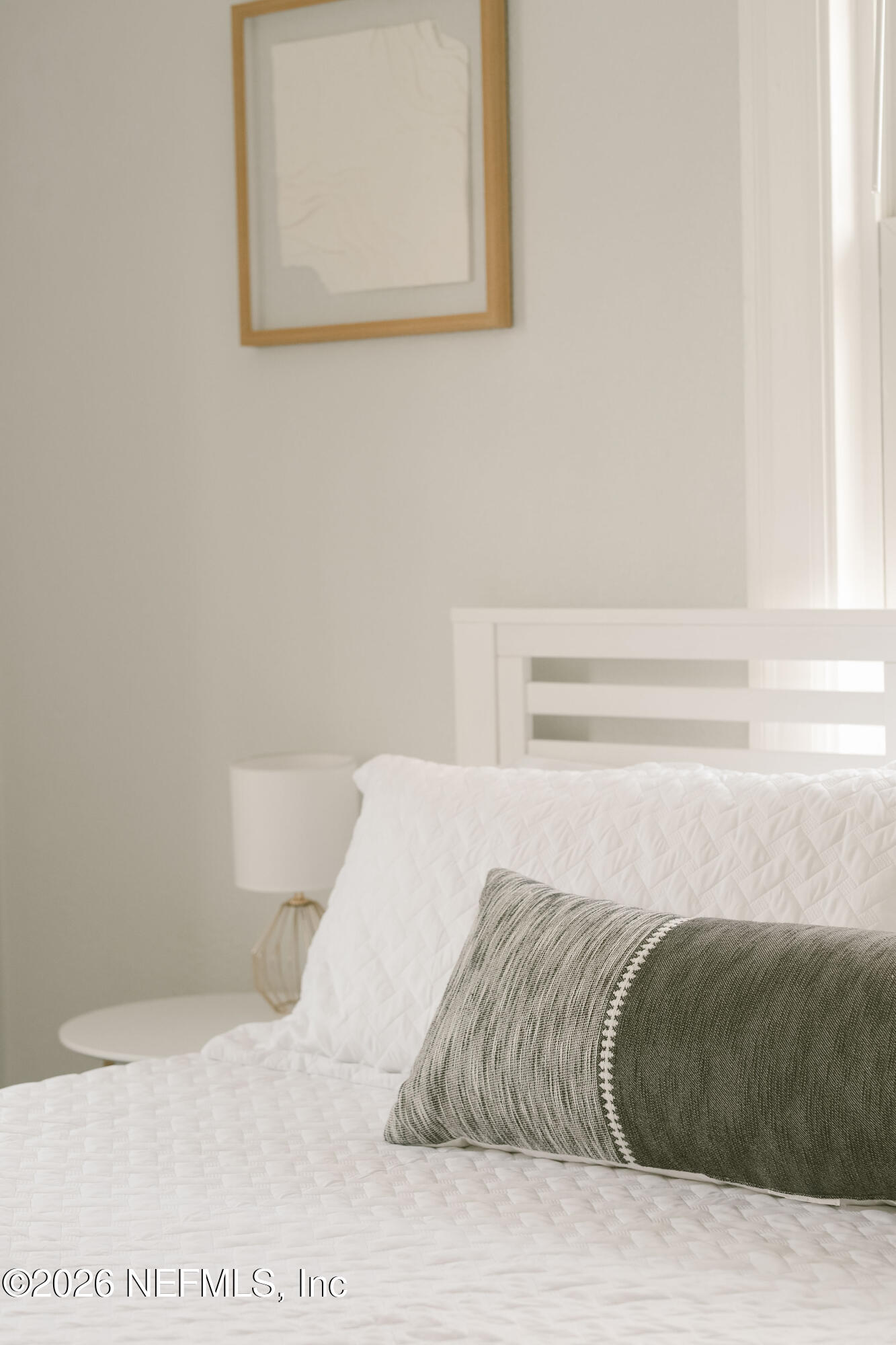 212 Oak Street Neptune Beach, FL 32266 - Photo 15 of 43 a bedroom with a bed and a window