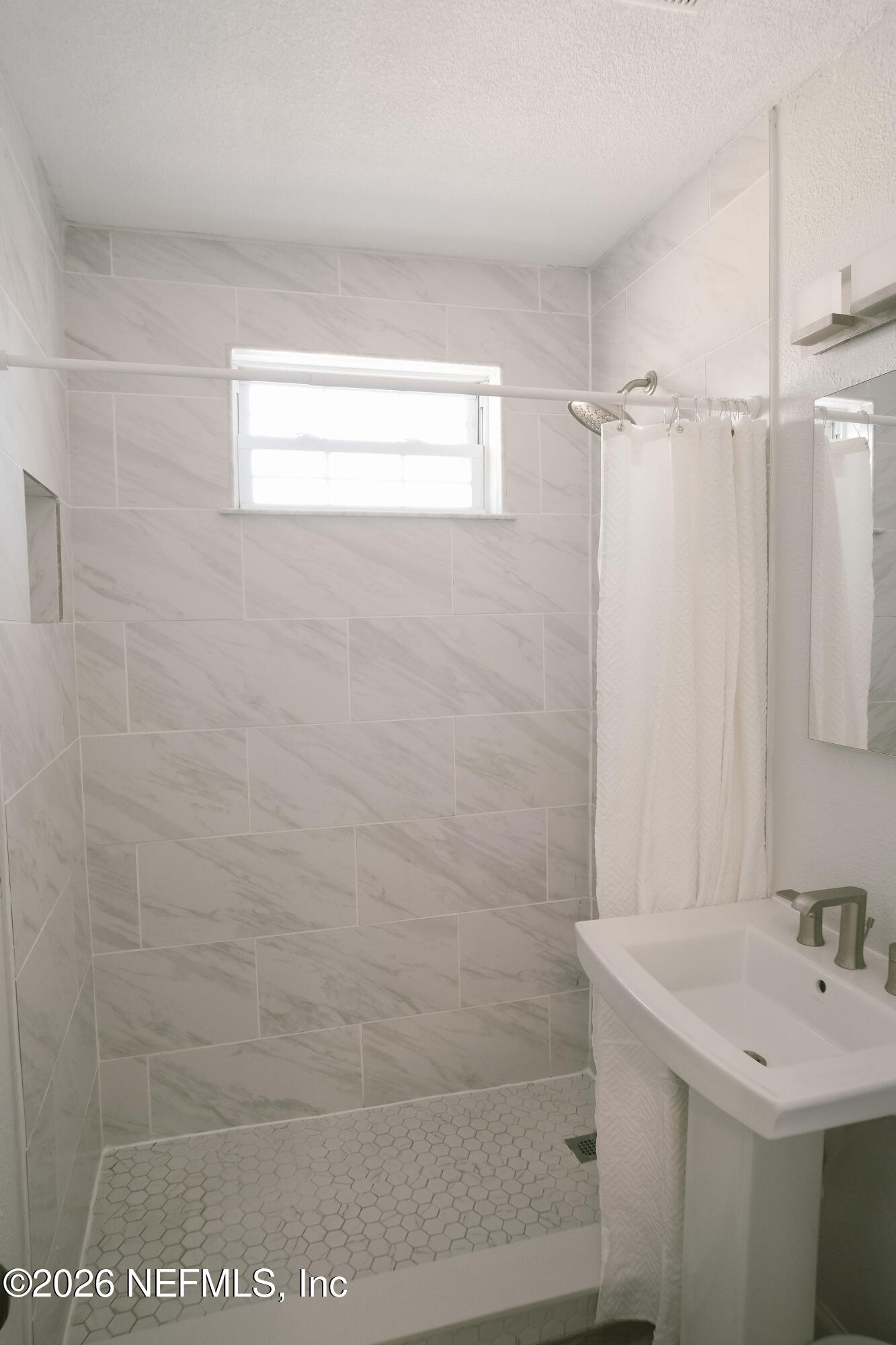 212 Oak Street Neptune Beach, FL 32266 - Photo 24 of 43 a bathroom with a sink a toilet and shower