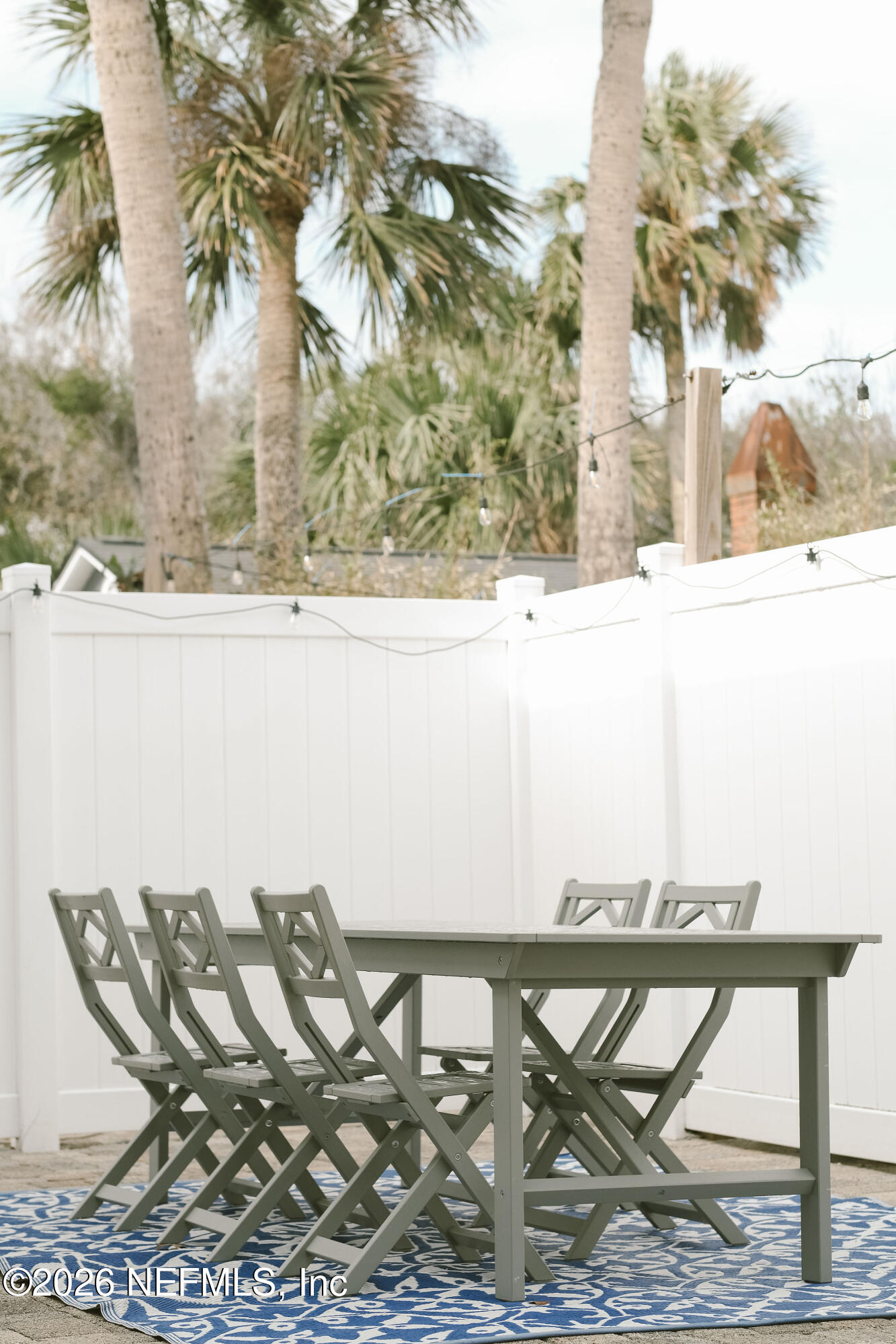 212 Oak Street Neptune Beach, FL 32266 - Photo 37 of 43 a view of a chairs and table in the patio