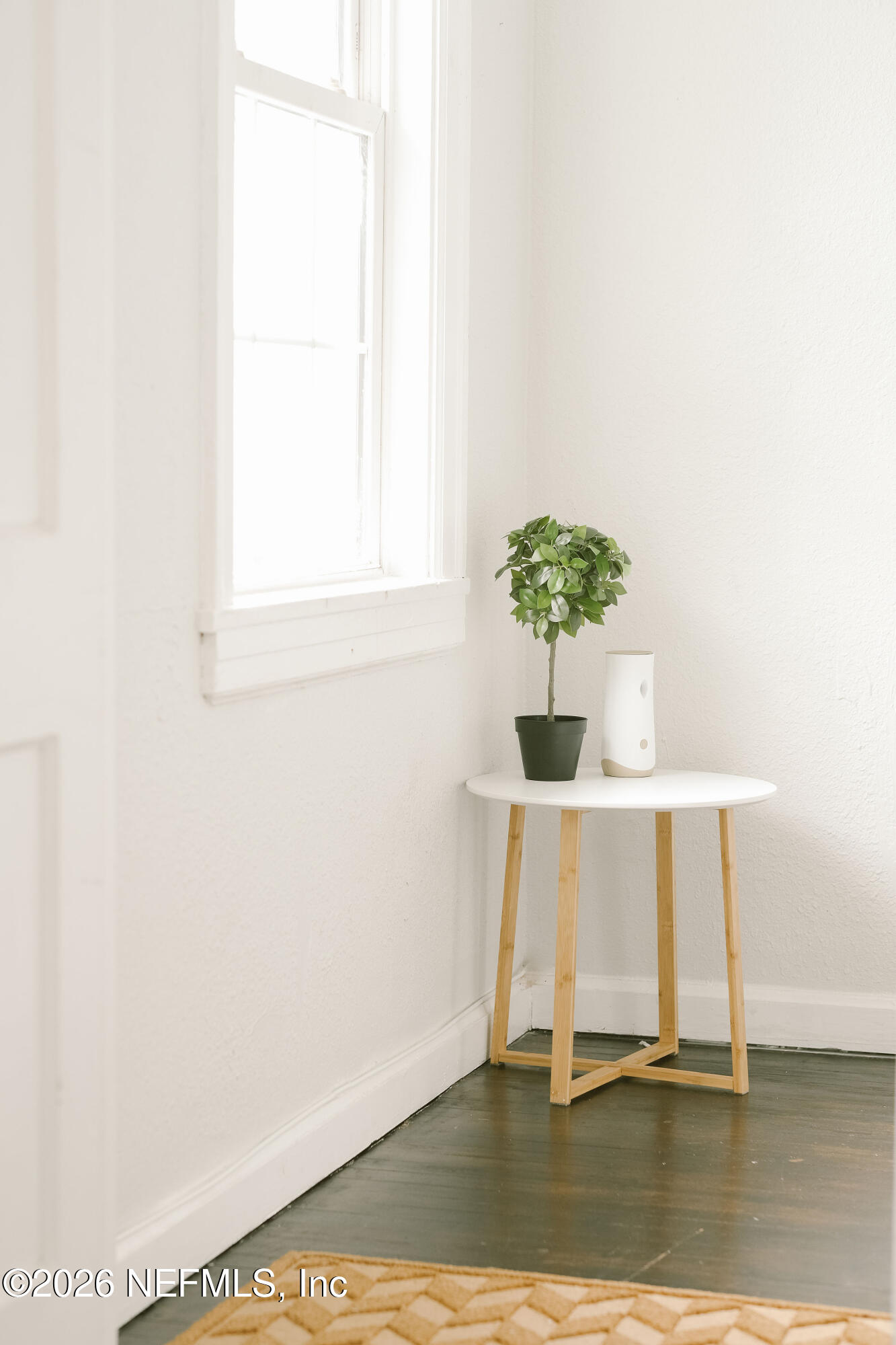 212 Oak Street Neptune Beach, FL 32266 - Photo 6 of 43 a view of a room with a table and a potted plant