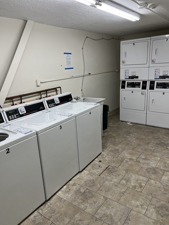 36 Bellvista Road, Unit 47 Boston, MA 02135 - Photo 11 of 12 a utility room with dryer and washer