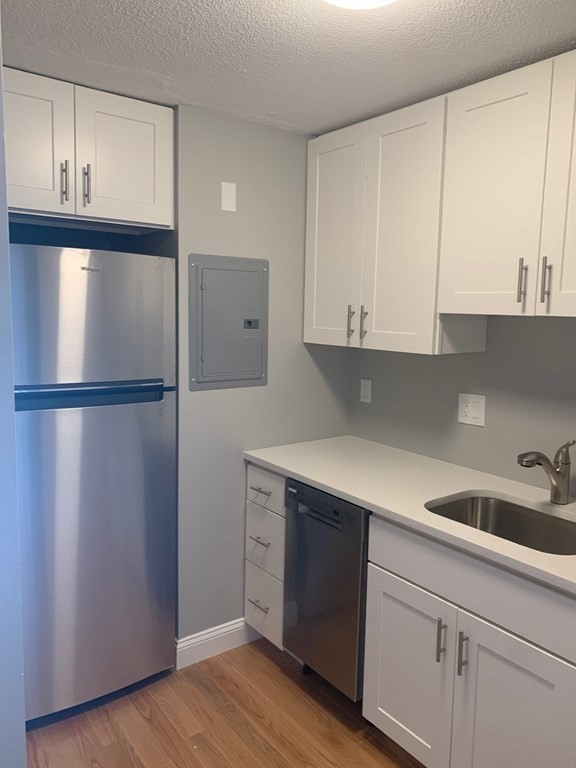 36 Bellvista Road, Unit 47 Boston, MA 02135 - Photo 3 of 12 a kitchen with a sink and cabinets