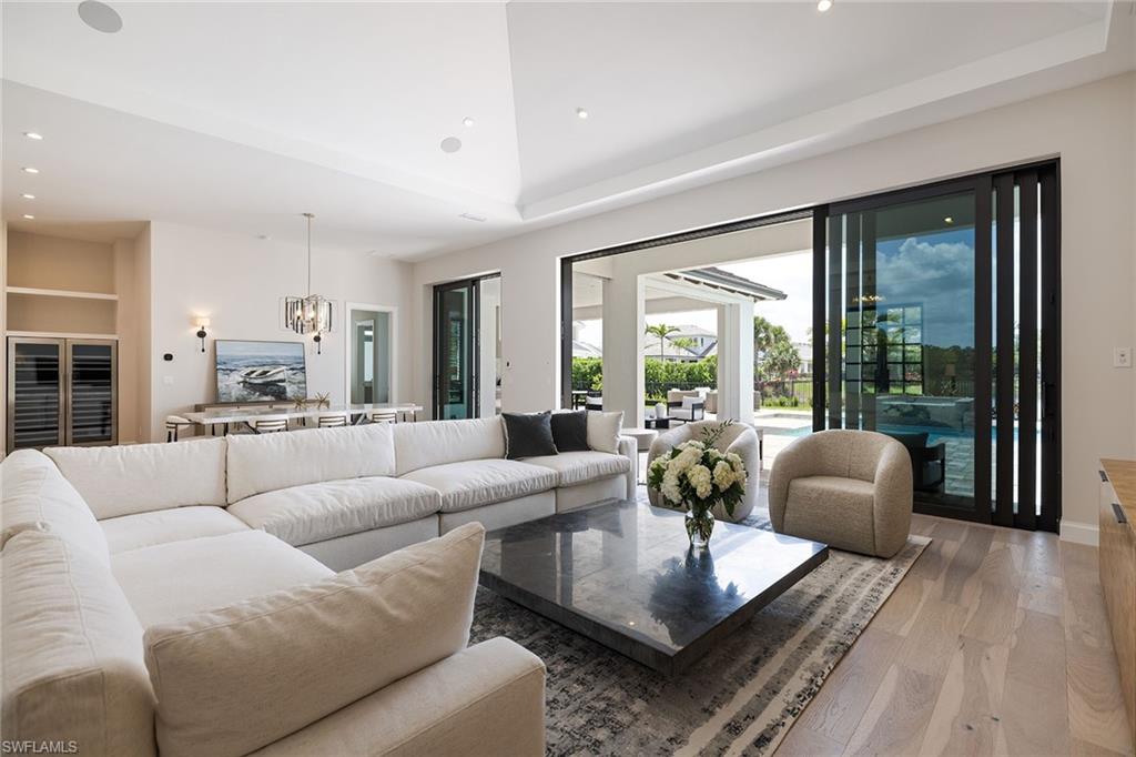 16776 Enclave Circle Naples, FL 34110 - Photo 14 of 50 a living room with furniture and a large window