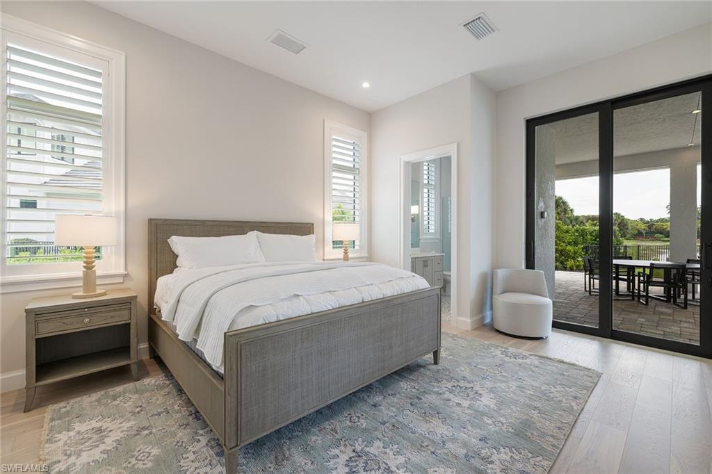 16776 Enclave Circle Naples, FL 34110 - Photo 25 of 50 a bedroom with bed and balcony with couch