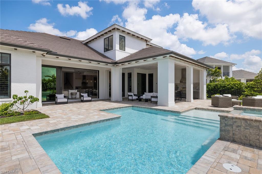 16776 Enclave Circle Naples, FL 34110 - Photo 28 of 50 a view of a house with furniture and garden