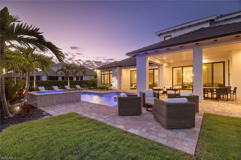 16776 Enclave Circle Naples, FL 34110 - Photo 3 of 50 a view of a patio with couches and table and chairs and potted plants