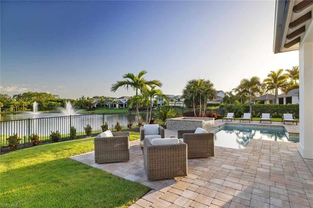16776 Enclave Circle Naples, FL 34110 - Photo 33 of 50 a view of a lake with a patio