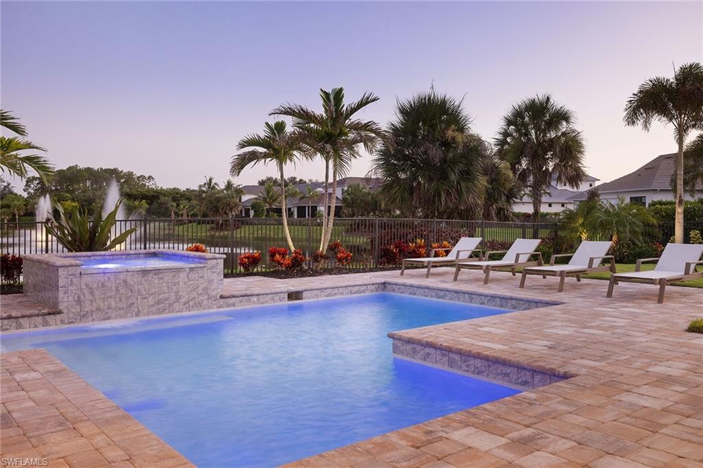16776 Enclave Circle Naples, FL 34110 - Photo 37 of 50 a view of a swimming pool with chairs