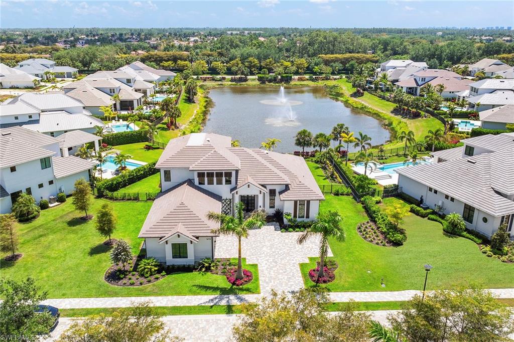 16776 Enclave Circle Naples, FL 34110 - Photo 50 of 50 an aerial view of residential houses with outdoor space and river