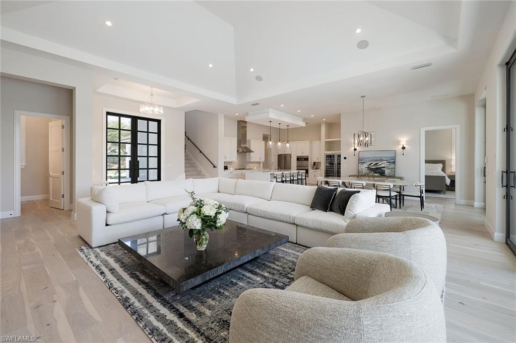 16776 Enclave Circle Naples, FL 34110 - Photo 5 of 50 a living room with furniture potted plant and a table
