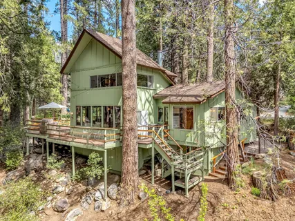 front view of a house with a tree